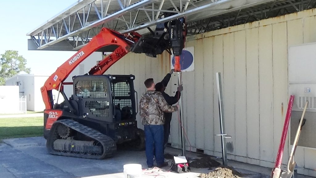 Canopy Tie-Down. Helical Piles used to anchor canopy so that it can resist hurricane force winds. Work as well in tension as they do compression.